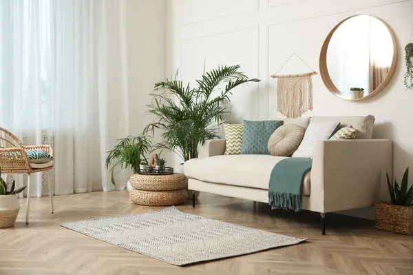 Bright airy living room with tropical plants and natural light